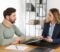 Injured man consulting with a Best Personal Injury Lawyer in Las Vegas, discussing legal paperwork after a car accident.