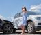 Person examining a car crash scene in Las Vegas while consulting with a car accident lawyer