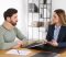 Injured man consulting with a Best Personal Injury Lawyer in Las Vegas, discussing legal paperwork after an accident.