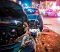 Close-up of a nighttime collision scene with two severely damaged vehicles and police presence, representing the urgency of hiring a car accident attorney.