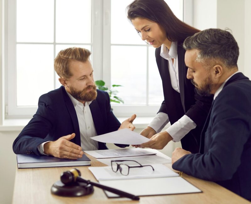 Auto accident attorney Las Vegas NV meeting with clients to review case documents in a law office