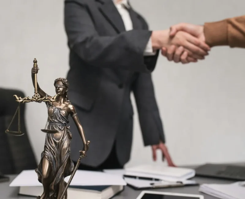 Personal injury attorney in Las Vegas shaking hands with client in Nevada law firm office