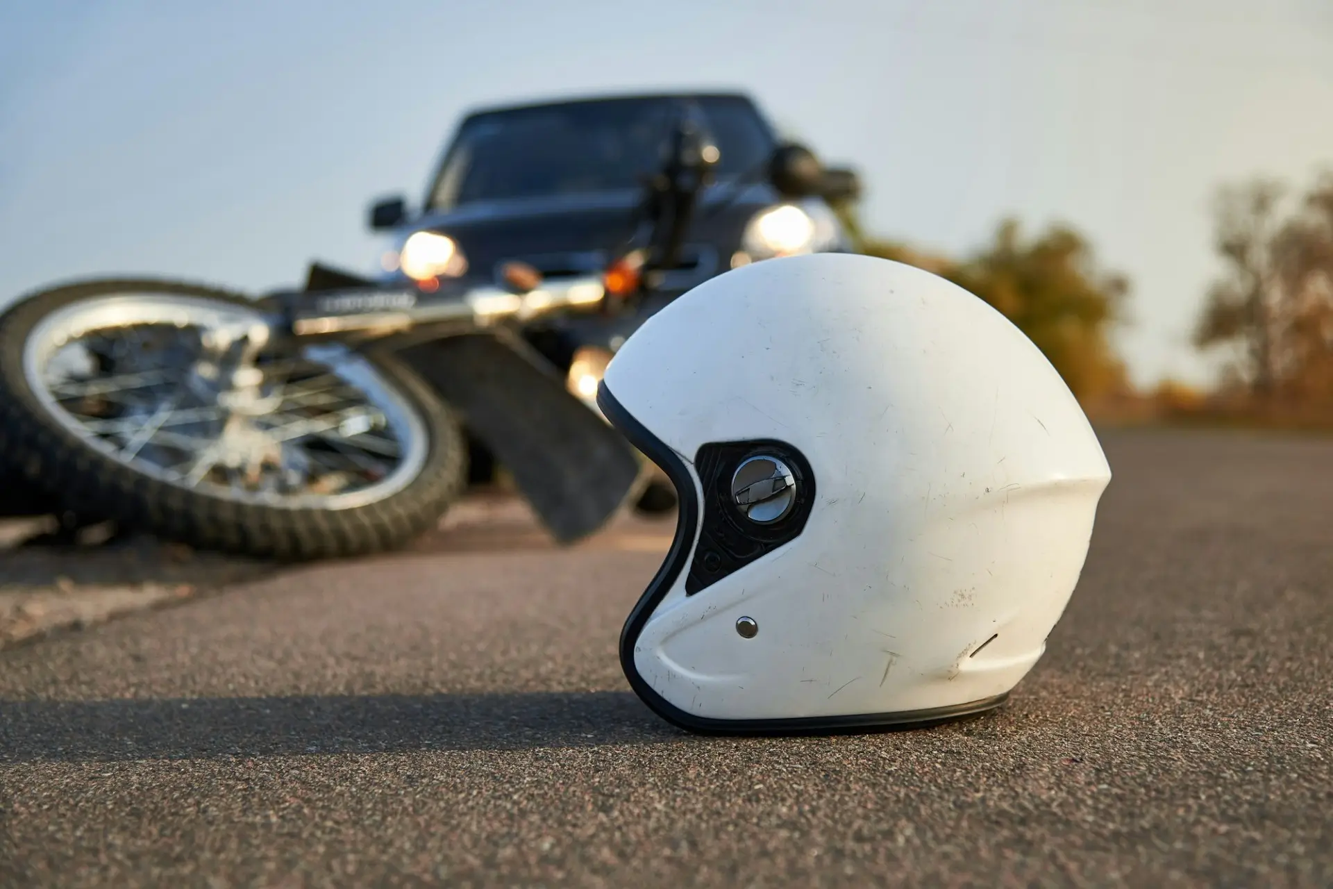 Helmet on the road after a hit-and-run crash, representing cases handled by motorcycle accident lawyers in Las Vegas.